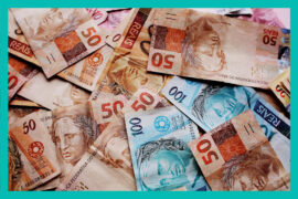 notas de dinheiro brasileiro espalhadas (empréstimo consignado do Auxílio Brasil)